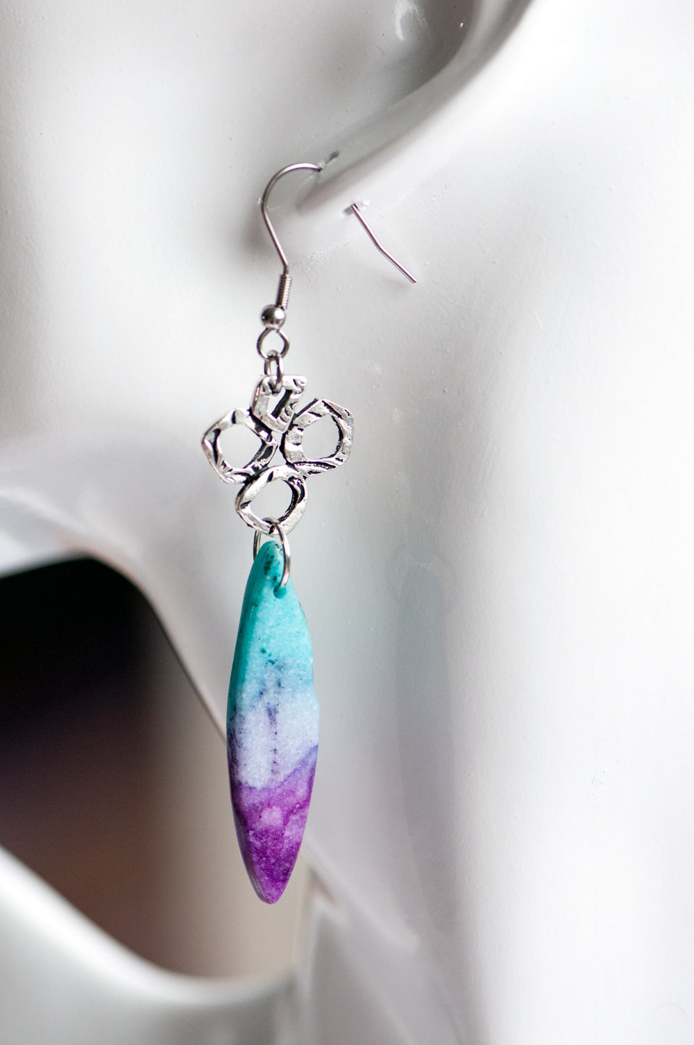 These gorgeous dangle earrings combine dyed Calcite in purple and turquoise with fun and funky TierraCast silver links on stainless steel hooks