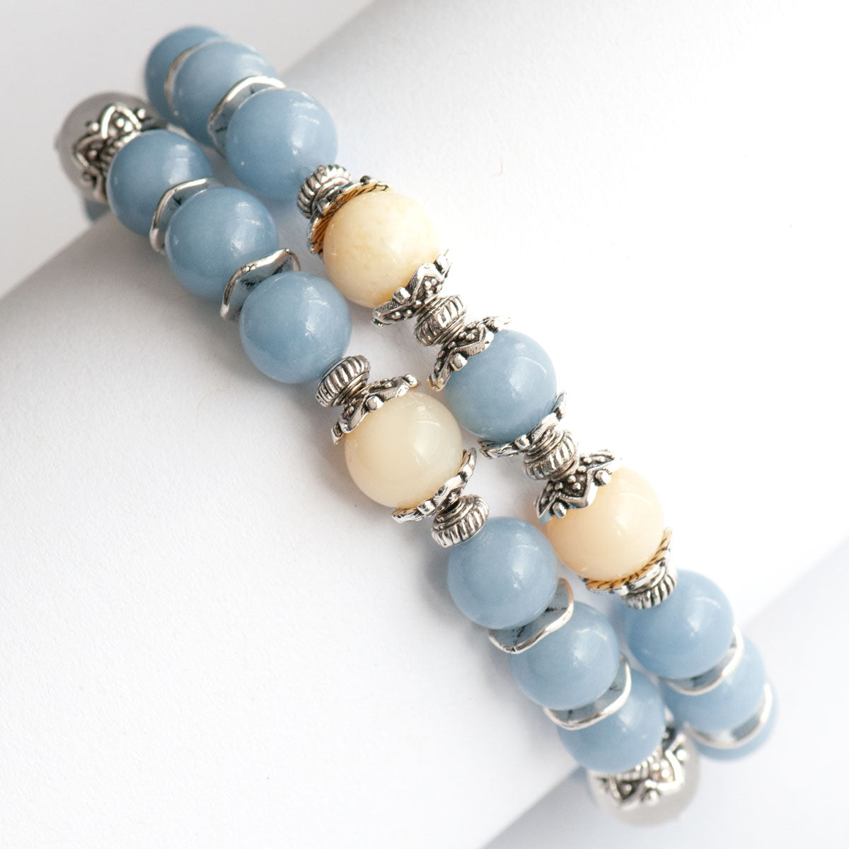 Supporting bracelet with Angelite and Yellow Opal rounds in the Snow Angel set.