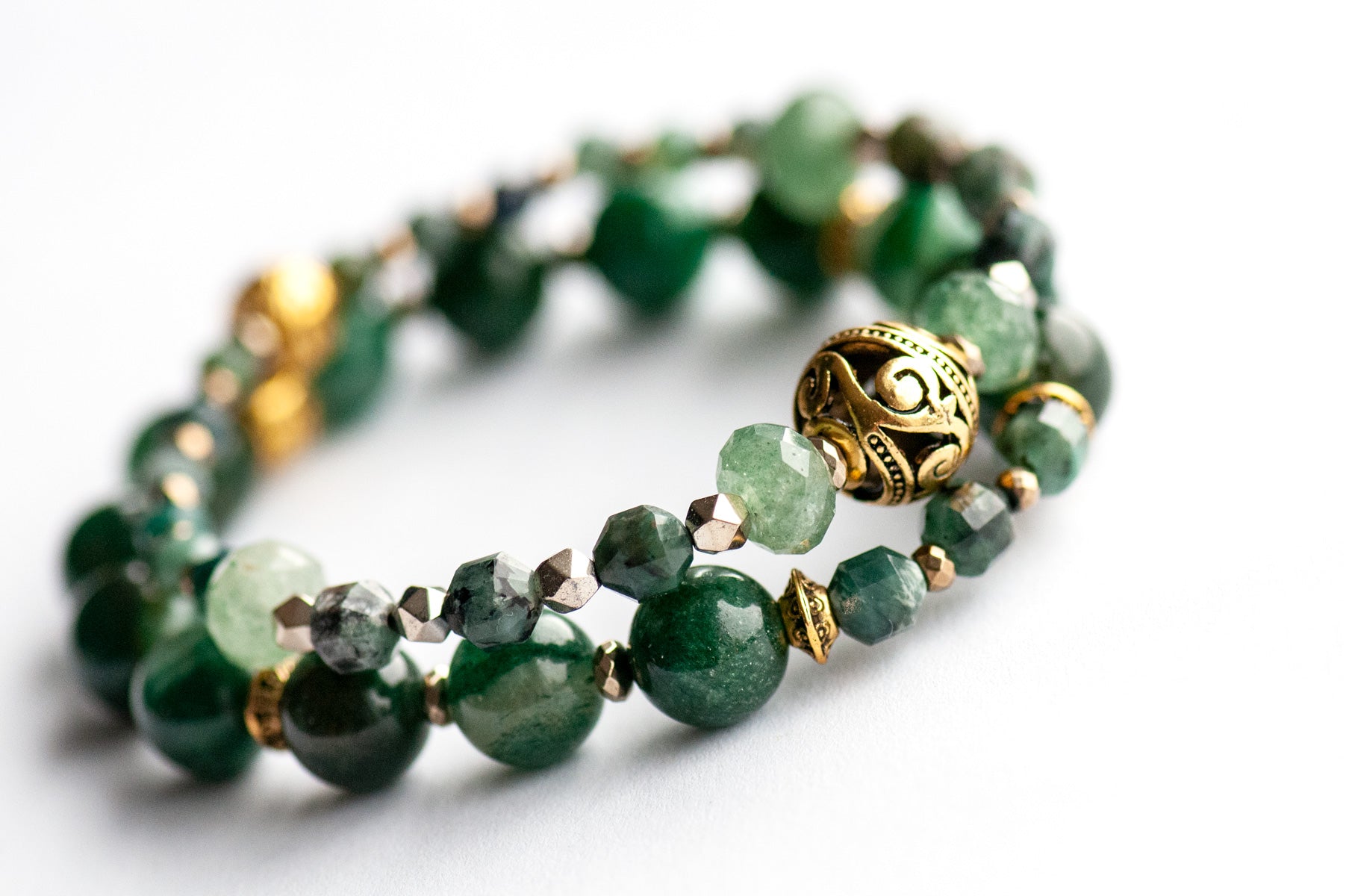 May birthstone bracelet featuring green gemstones: emerald, mica, green strawberry quartz, and moss agate, with gold hematite and gold plated accent beads. Handmade in New Brunswick Canada