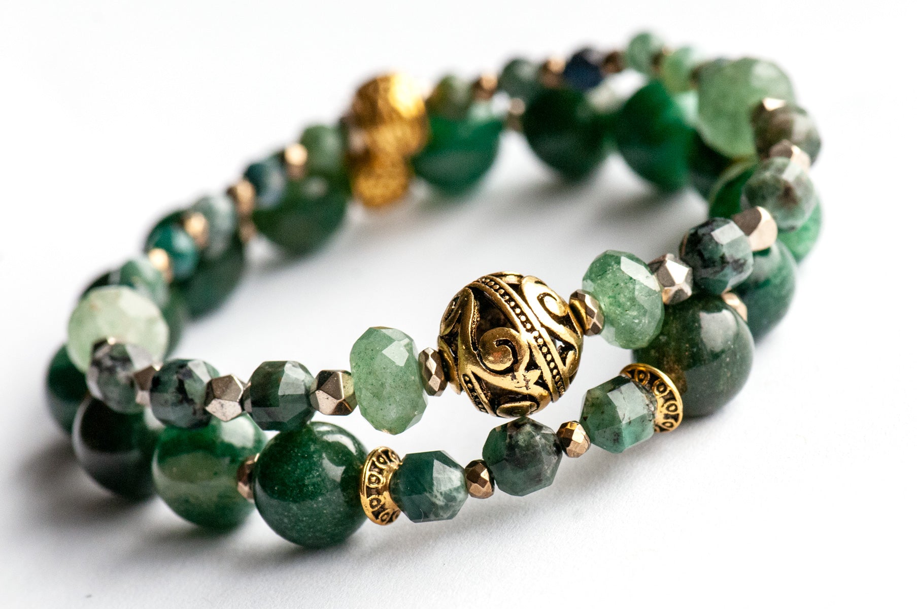 May birthstone bracelet featuring green gemstones: emerald, mica, green strawberry quartz, and moss agate, with gold hematite and gold plated accent beads. Handmade in New Brunswick Canada