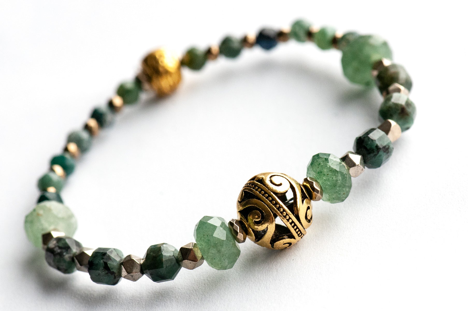 May birthstone bracelet featuring green gemstones: emerald, mica, green strawberry quartz, and moss agate, with gold hematite and gold plated accent beads. Handmade in New Brunswick Canada