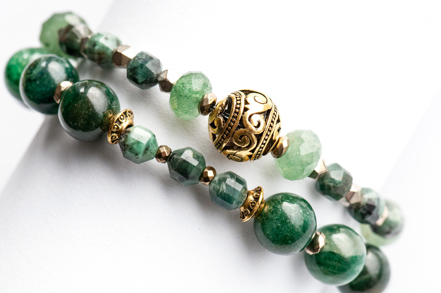 May birthstone bracelet featuring green gemstones: emerald, mica, green strawberry quartz, and moss agate, with gold hematite and gold plated accent beads. Handmade in New Brunswick Canada