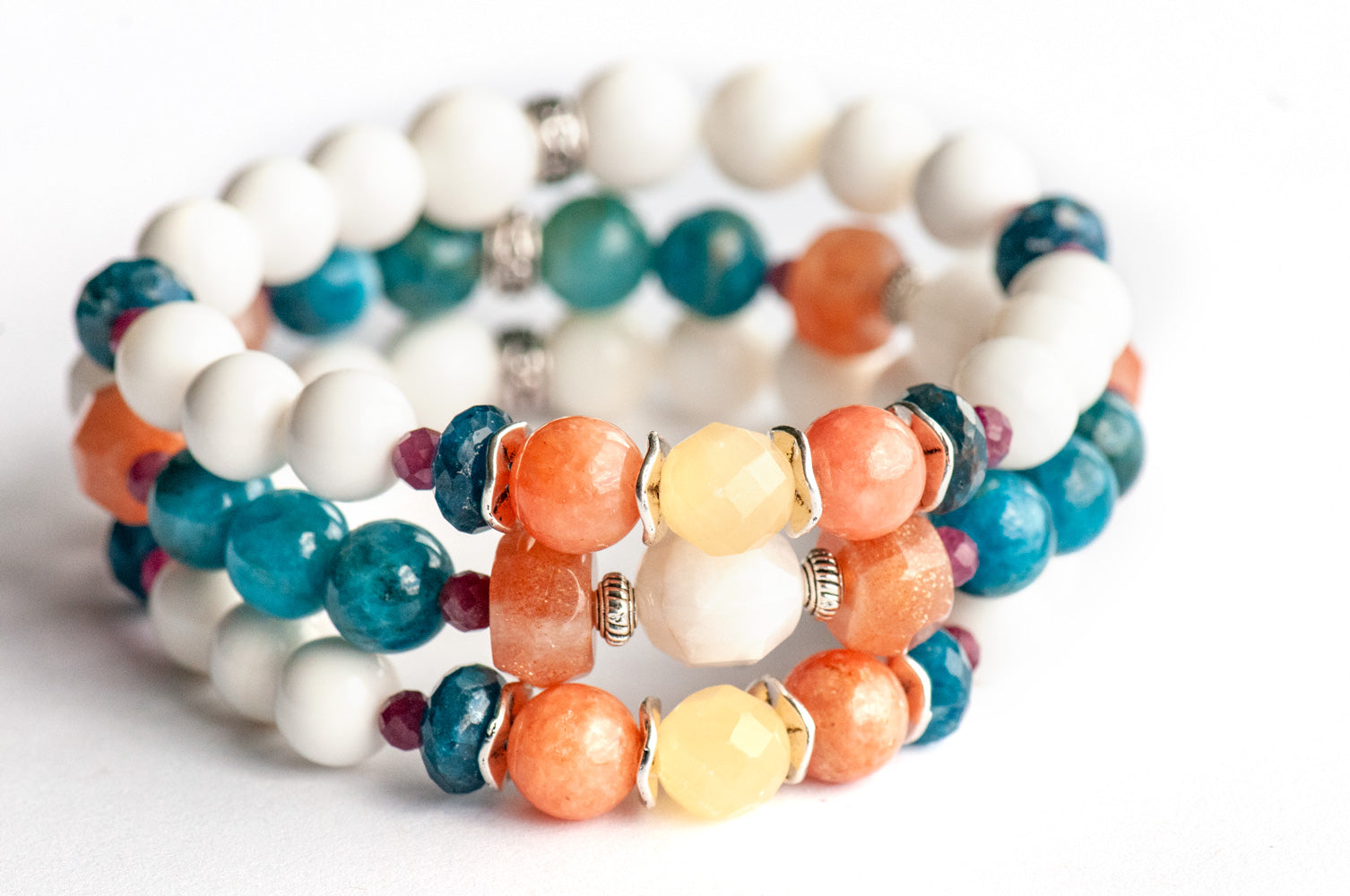 Fierce Radiance bracelet set with blue apatite, orange Calcite, yellow Jade, plum tourmaline, and golden sunstone with white shell beads handmade in New Brunswick Canada