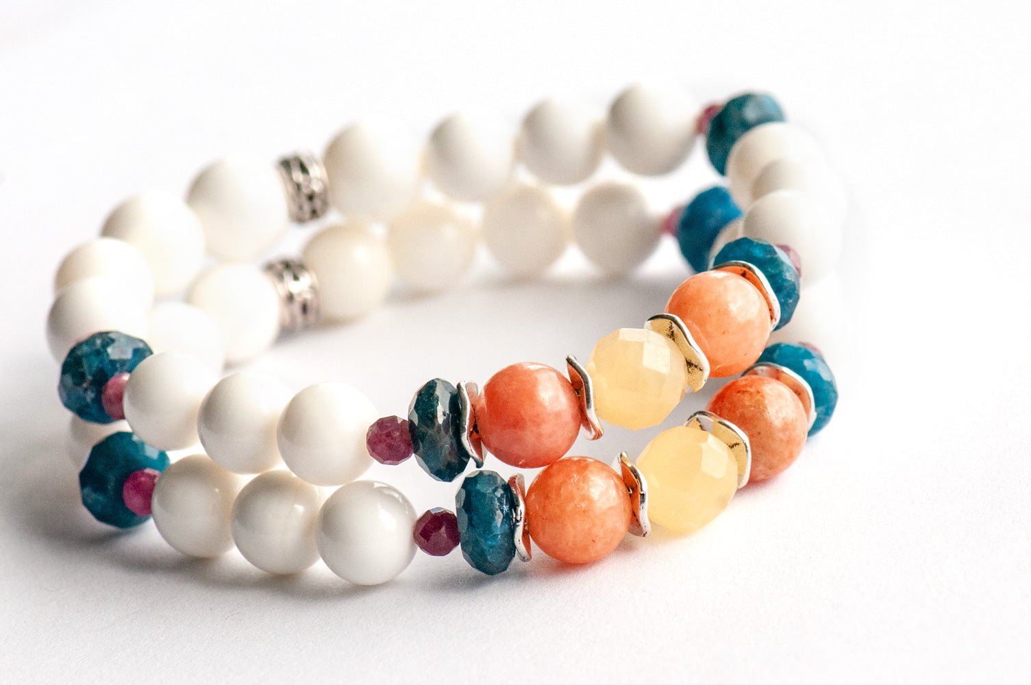 Fierce Radiance bracelet set with blue apatite, orange Calcite, yellow Jade, plum tourmaline, and golden sunstone with white shell beads handmade in New Brunswick Canada