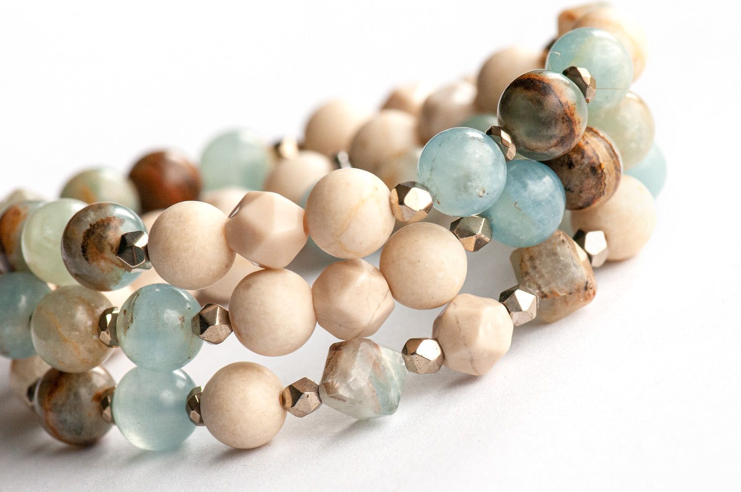 Sandy Shores mala-style triple wrap bracelet with Lemurian Aquitaine Calcite and petrified wood beads in soothing soft blues and beiges