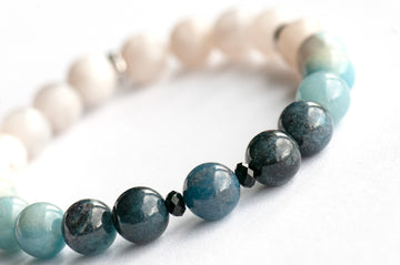 Single strand blue ombre Trolleite bracelet with black onyx accent beads and white Jade, handmade in New Brunswick Canada