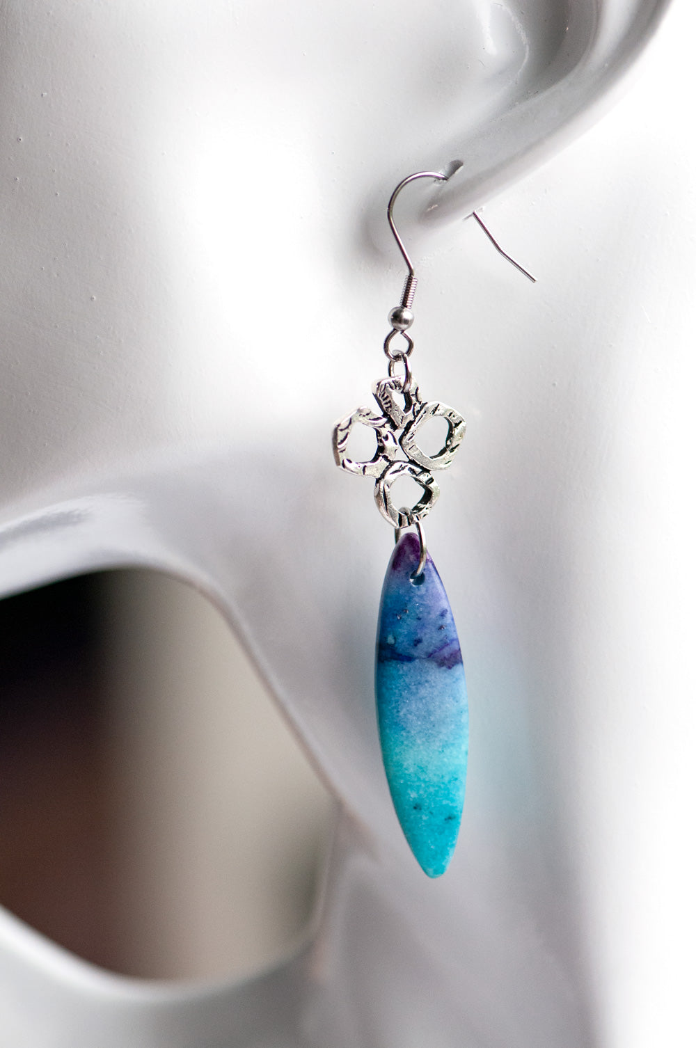 These gorgeous dangle earrings combine dyed Calcite in purple and turquoise with fun and funky TierraCast silver links on stainless steel hooks
