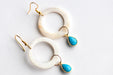 have your hoop and dangle too. carved shell rings dangle from gold plated hooks while turquoise howlite bezels dangle from the hoops