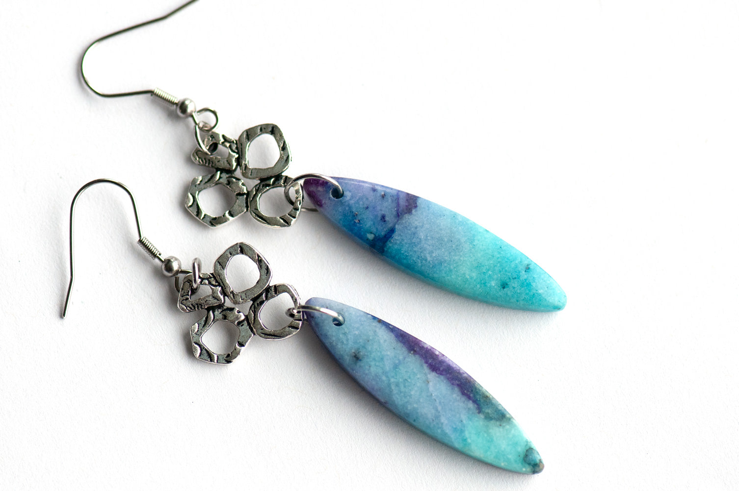 These gorgeous dangle earrings combine dyed Calcite in purple and turquoise with fun and funky TierraCast silver links on stainless steel hooks