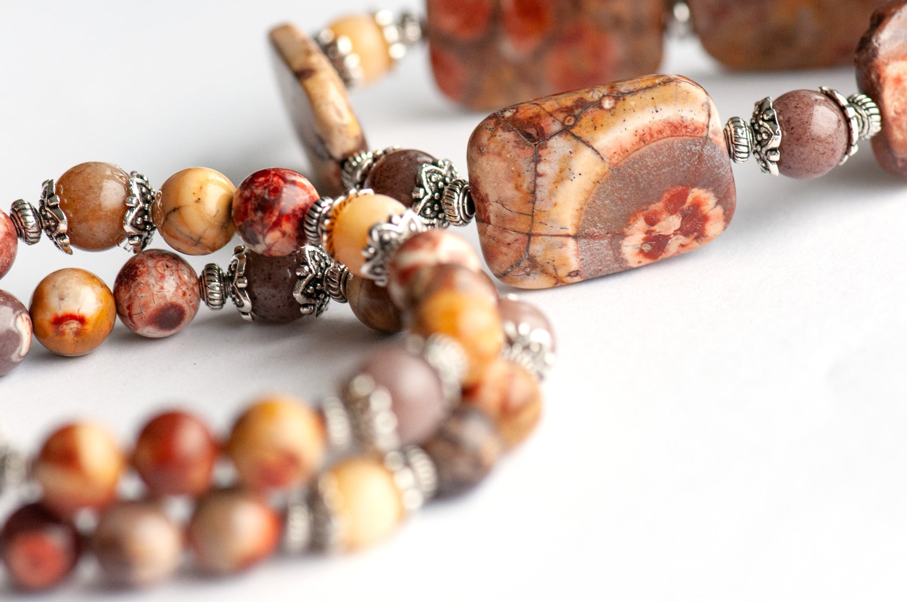'The Enchanted Forest Trio' – a handcrafted bracelet set with Birds Eye Rhyolite, yellow Burmese Jade & purple aventurine