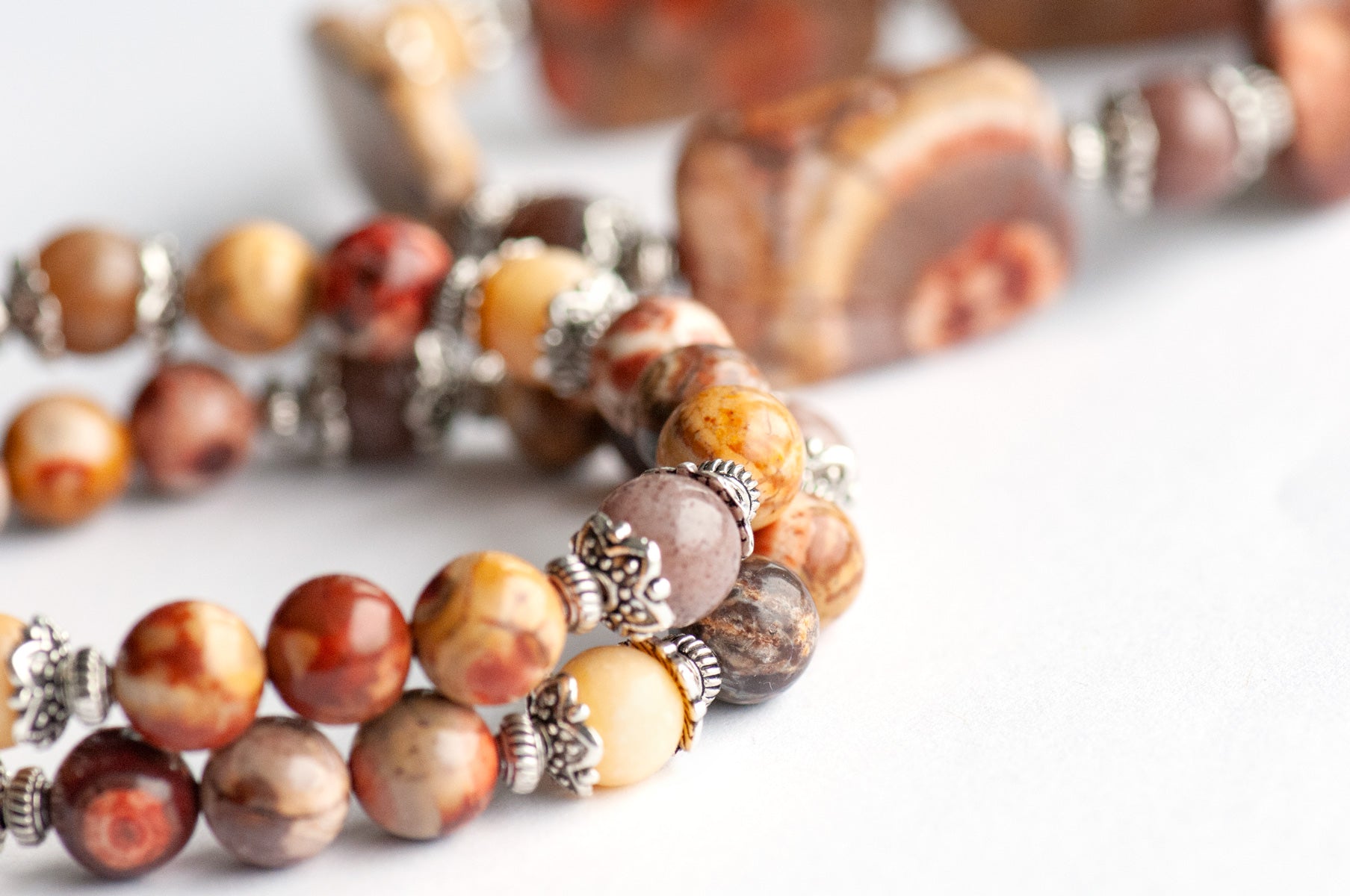 'The Enchanted Forest Trio' – a handcrafted bracelet set with Birds Eye Rhyolite, yellow Burmese Jade & purple aventurine