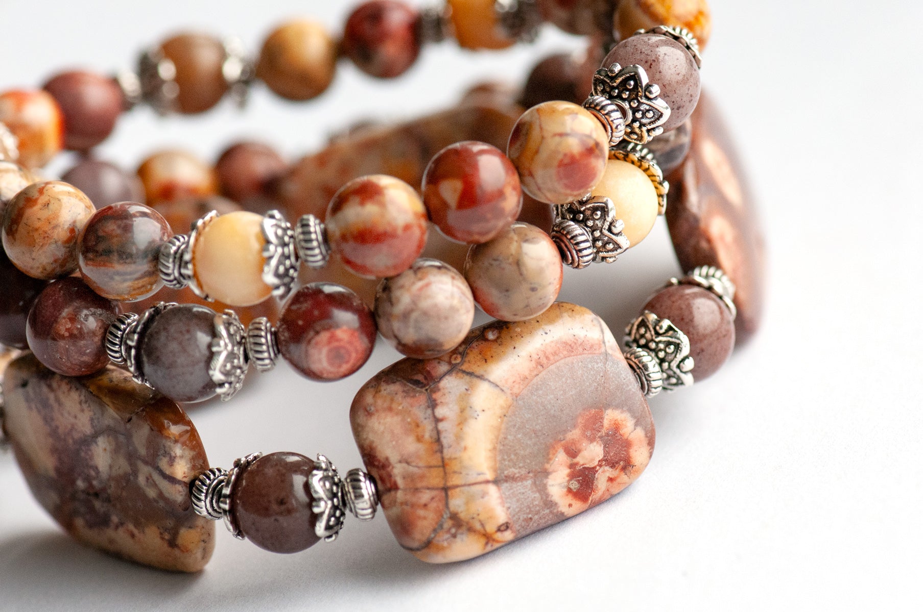 'The Enchanted Forest Trio' – a handcrafted bracelet set with Birds Eye Rhyolite, yellow Burmese Jade & purple aventurine