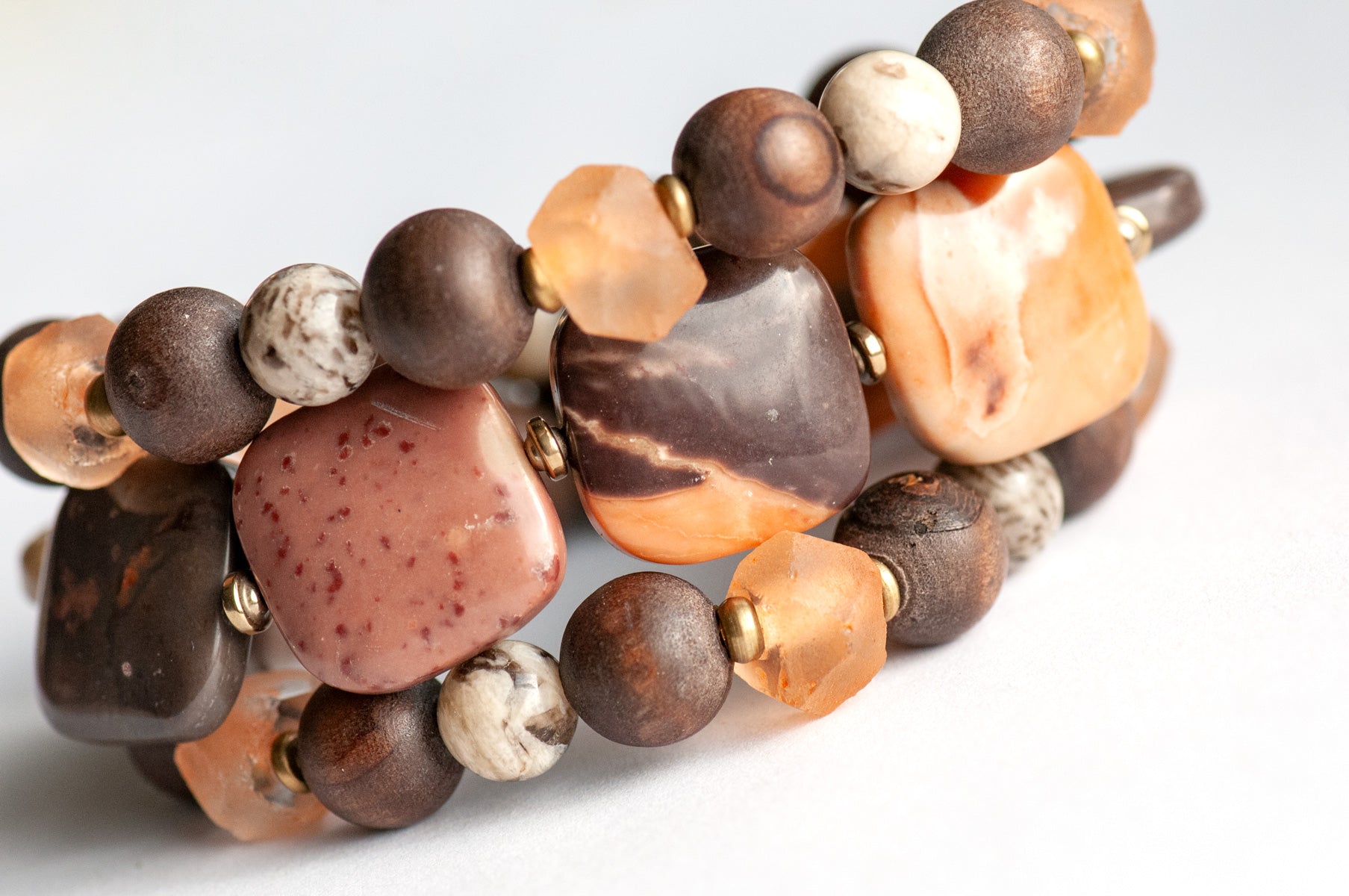 Safari Jasper, Graphic Feldspar, Olive Wood and Recycled glass in a handmade beaded bracelet