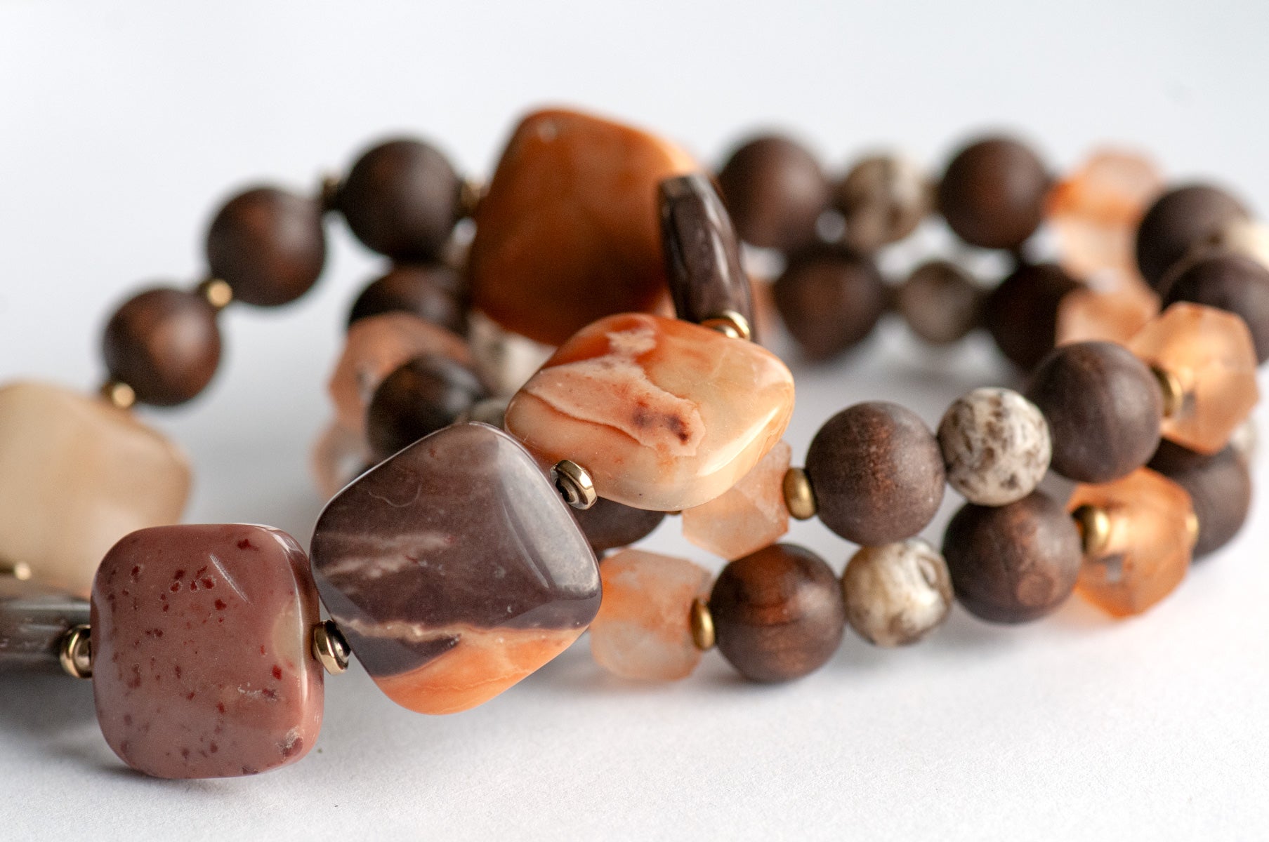 Safari Jasper, Graphic Feldspar, Olive Wood and Recycled glass in a handmade beaded bracelet