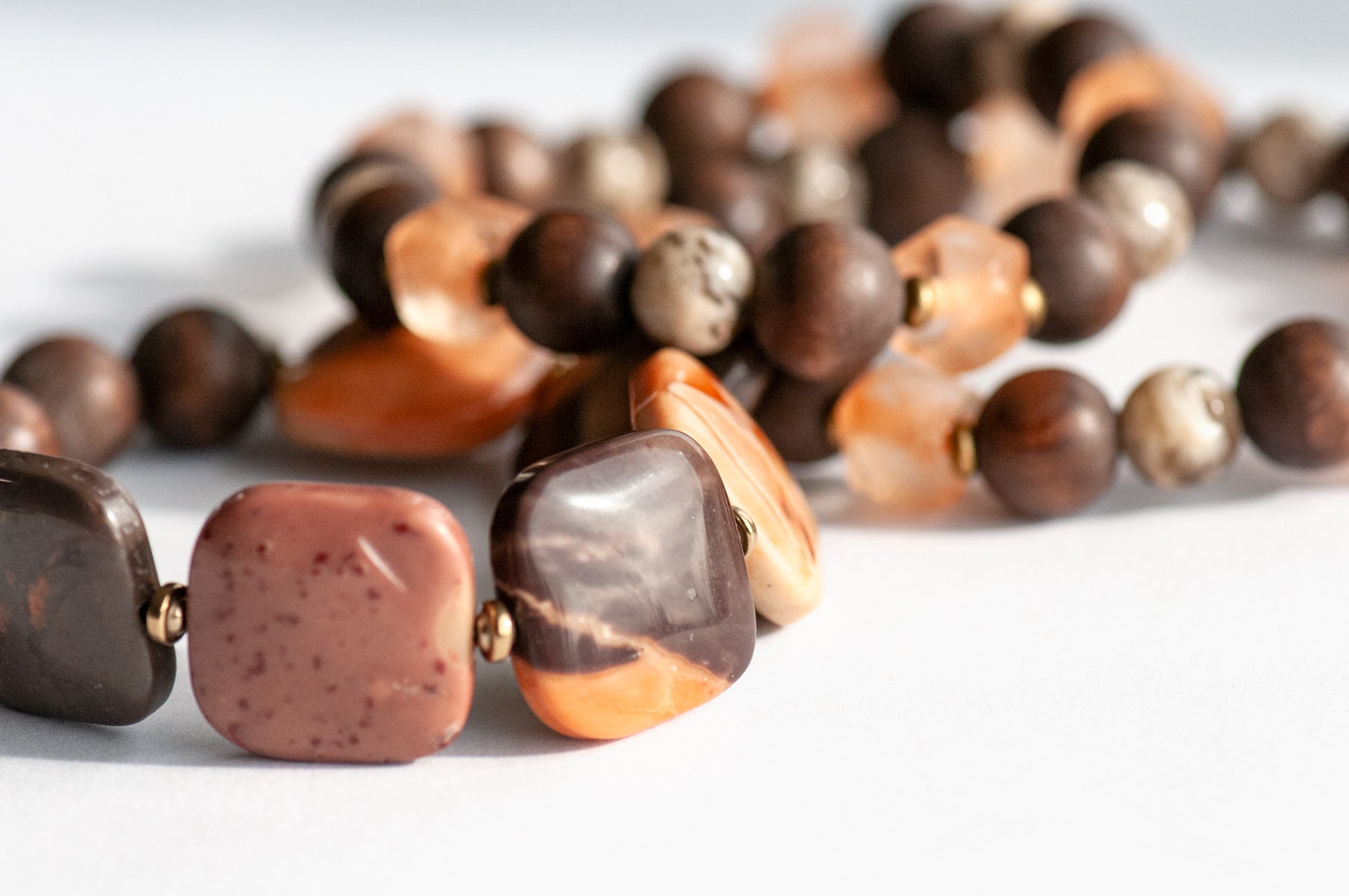 Safari Jasper, Graphic Feldspar, Olive Wood and Recycled glass in a handmade beaded bracelet