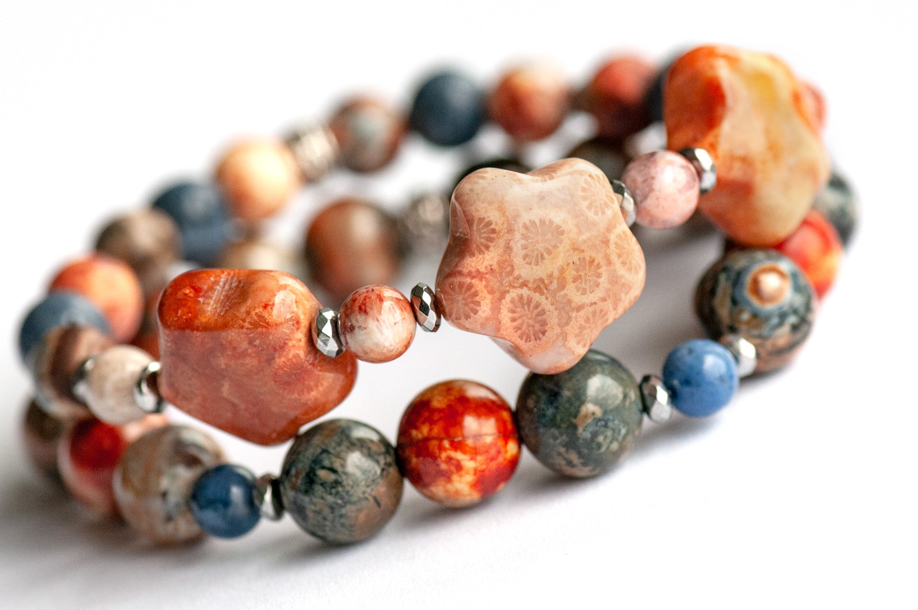 Handmade gemstone bracelet set of two featuring fossil coral, agate, hematite, and dumortierite 