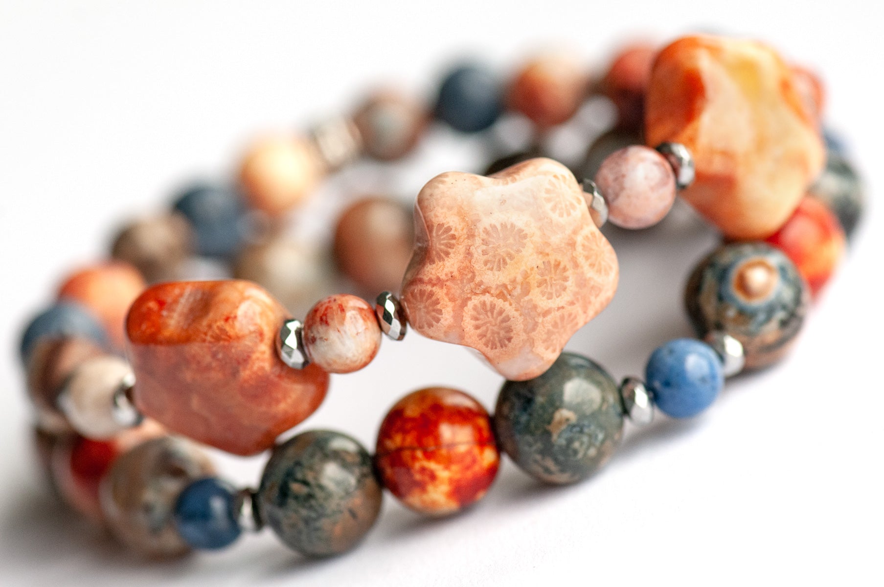 Handmade gemstone bracelet set of two featuring fossil coral, agate, hematite, and dumortierite 