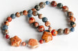 Handmade gemstone bracelet set of two featuring fossil coral, agate, hematite, and dumortierite 