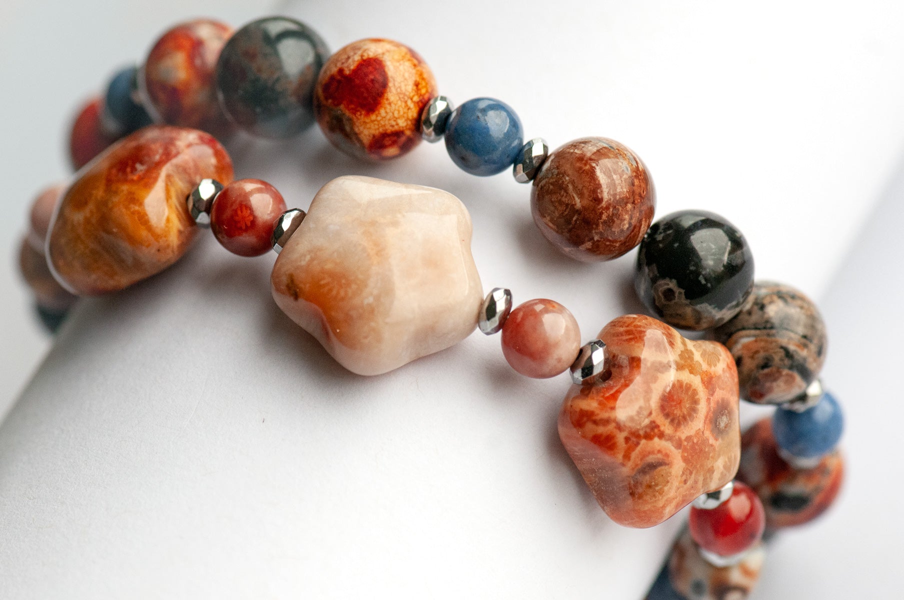 Handmade gemstone bracelet set of two featuring fossil coral, agate, hematite, and dumortierite 