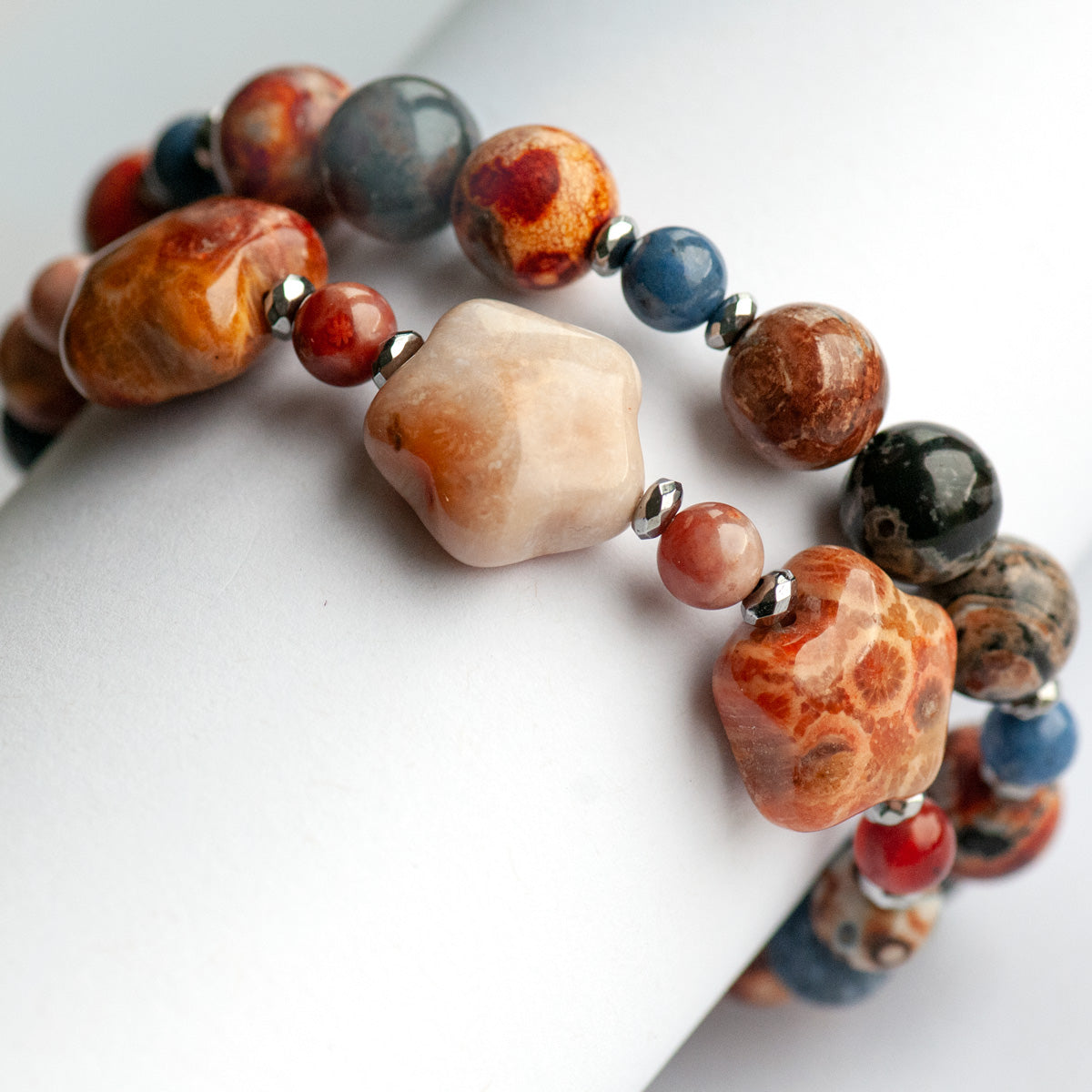 Handmade gemstone bracelet set of two featuring fossil coral, agate, hematite, and dumortierite 