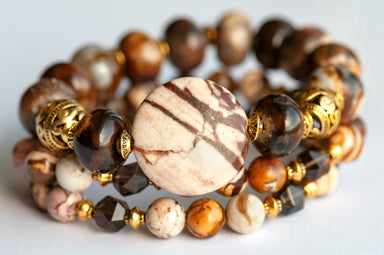 This handmade bracelet set in shades of brown, cream, and gold is an ode the Fall in the Forest