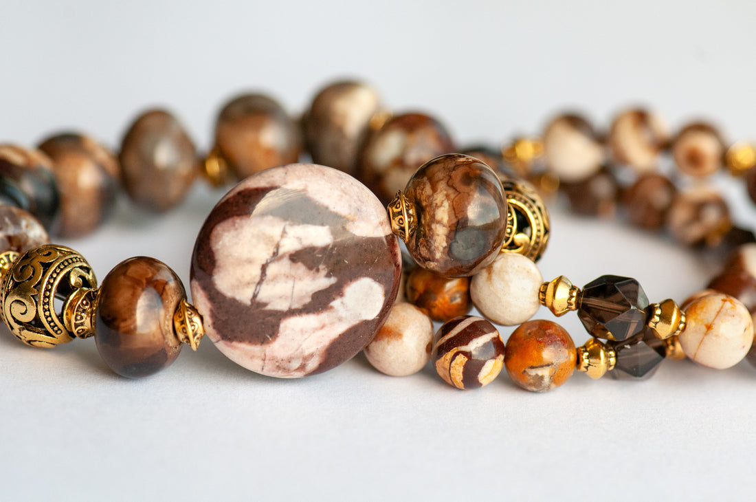 This handmade bracelet set in shades of brown, cream, and gold is an ode the Fall in the Forest