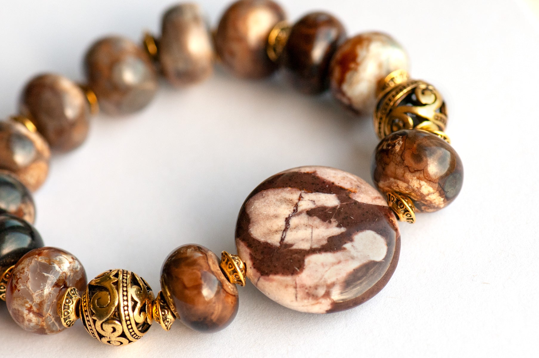Smoky Quartz and Botswana Agate handmade bracelet set with golden accents. 