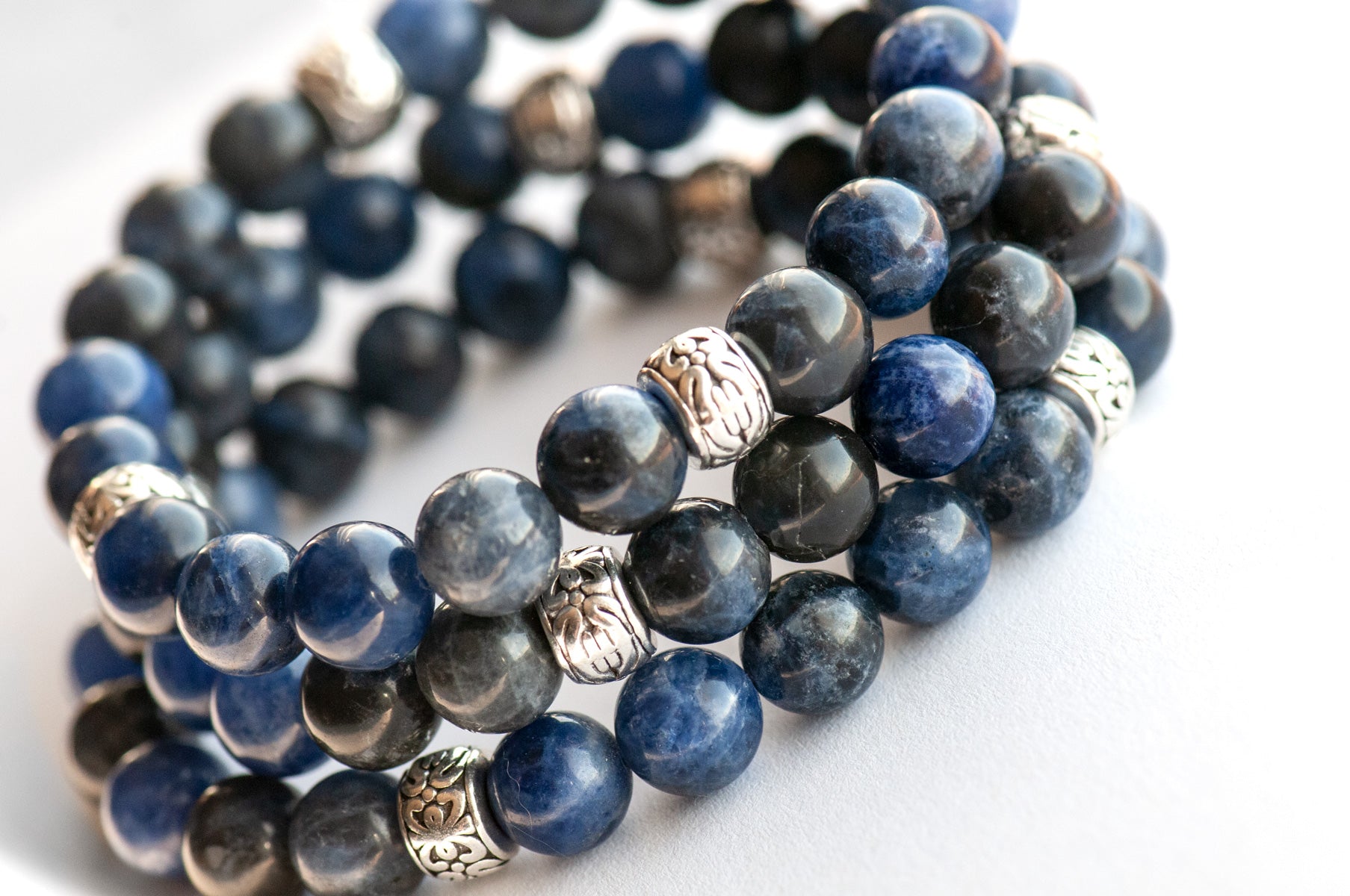 Stack of Beautiful A-grade blue sodalite stretch bracelets for sale separately. Handmade in New Brunswick Canada