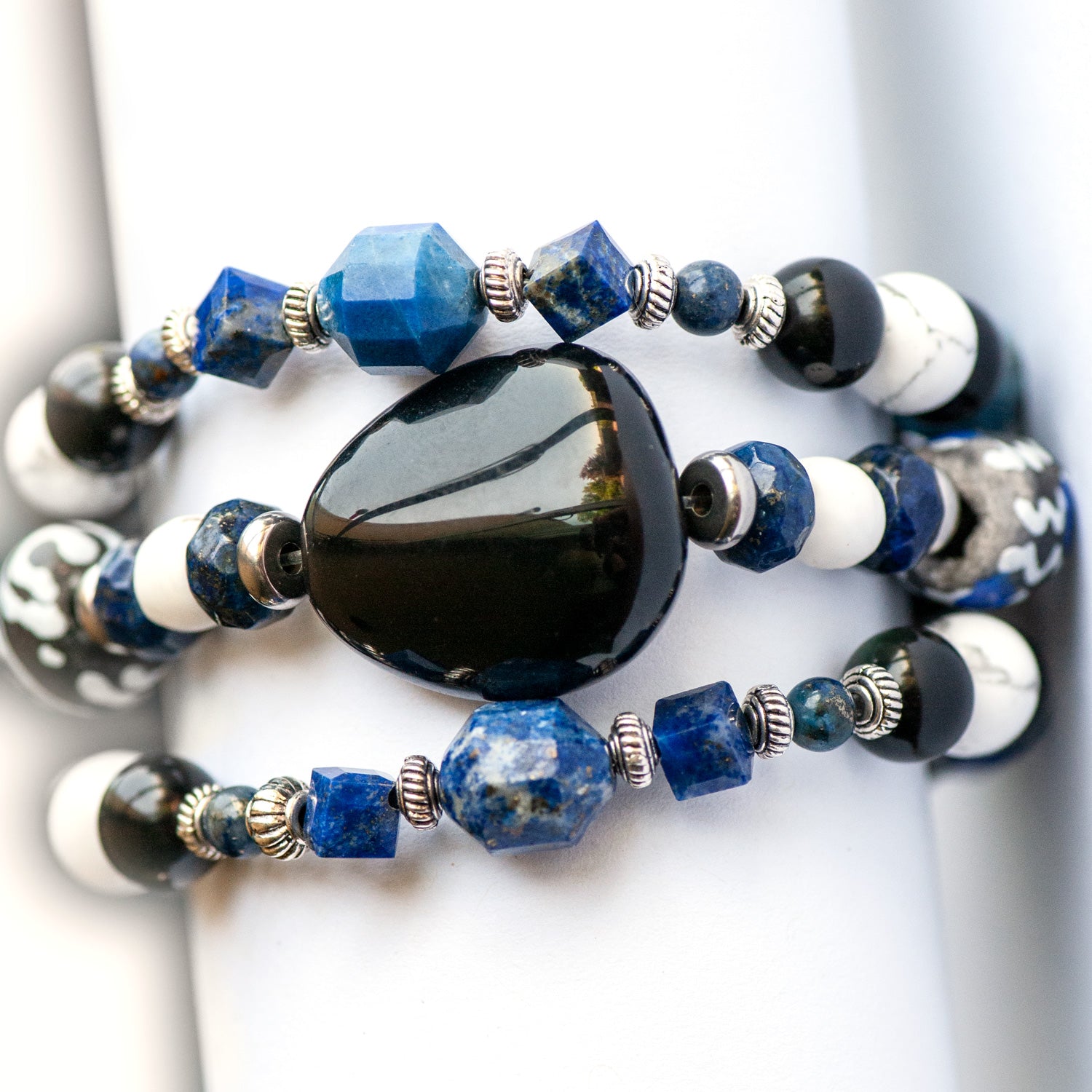 Fierce Guardian bracelet set handmade by Fierce Lynx designs featuring Obsidian, Lapis Lazuli, and howlite gemstone beads