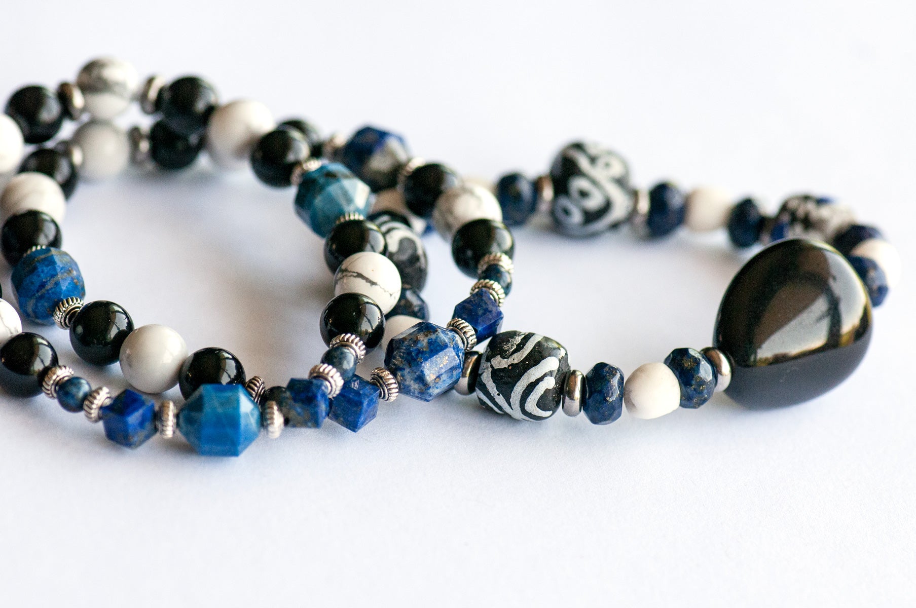 Fierce Guardian bracelet set handmade by Fierce Lynx designs featuring Obsidian, Lapis Lazuli, and howlite gemstone beads