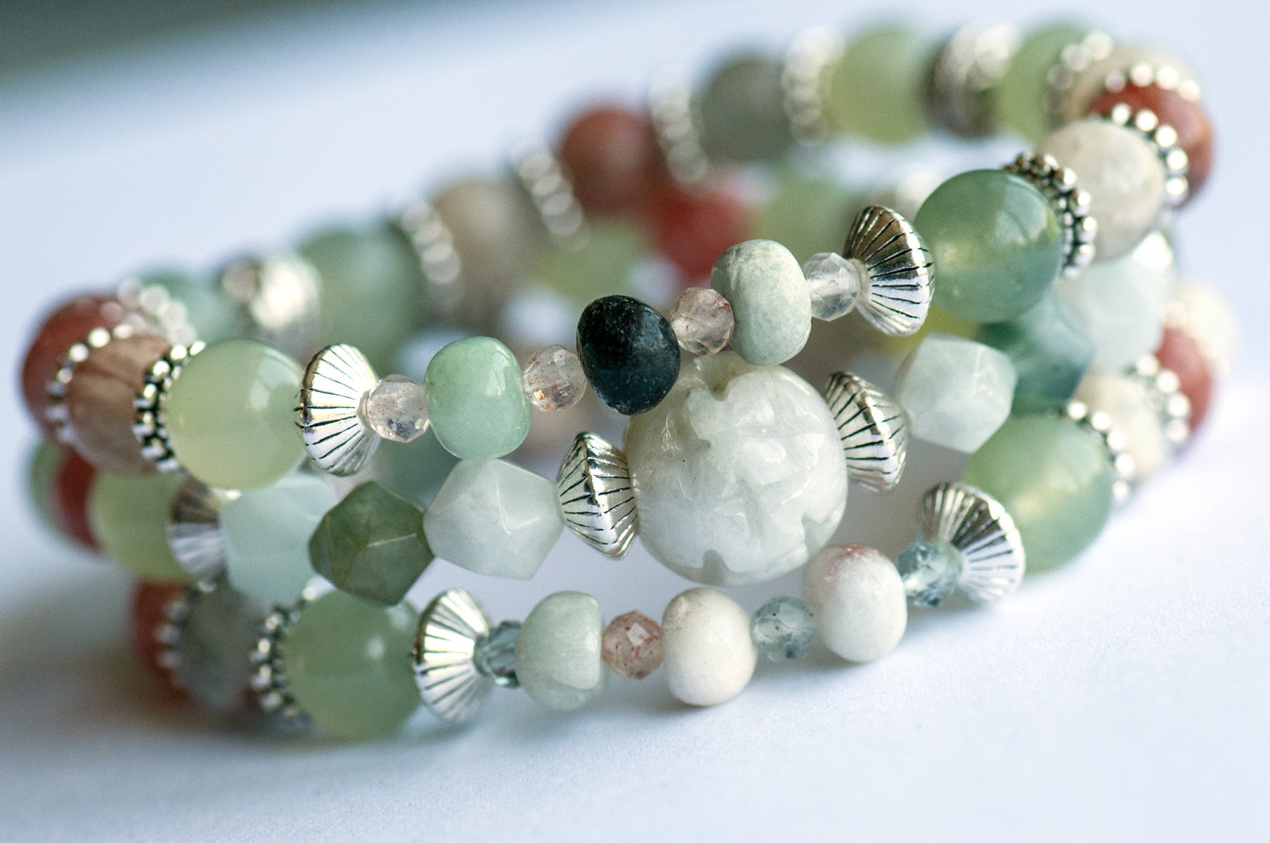 The Fierce Acceptance bracelet set is handmade with Jade, Arusha Sunstone, and Sepentine in calming shades of green and orange.
