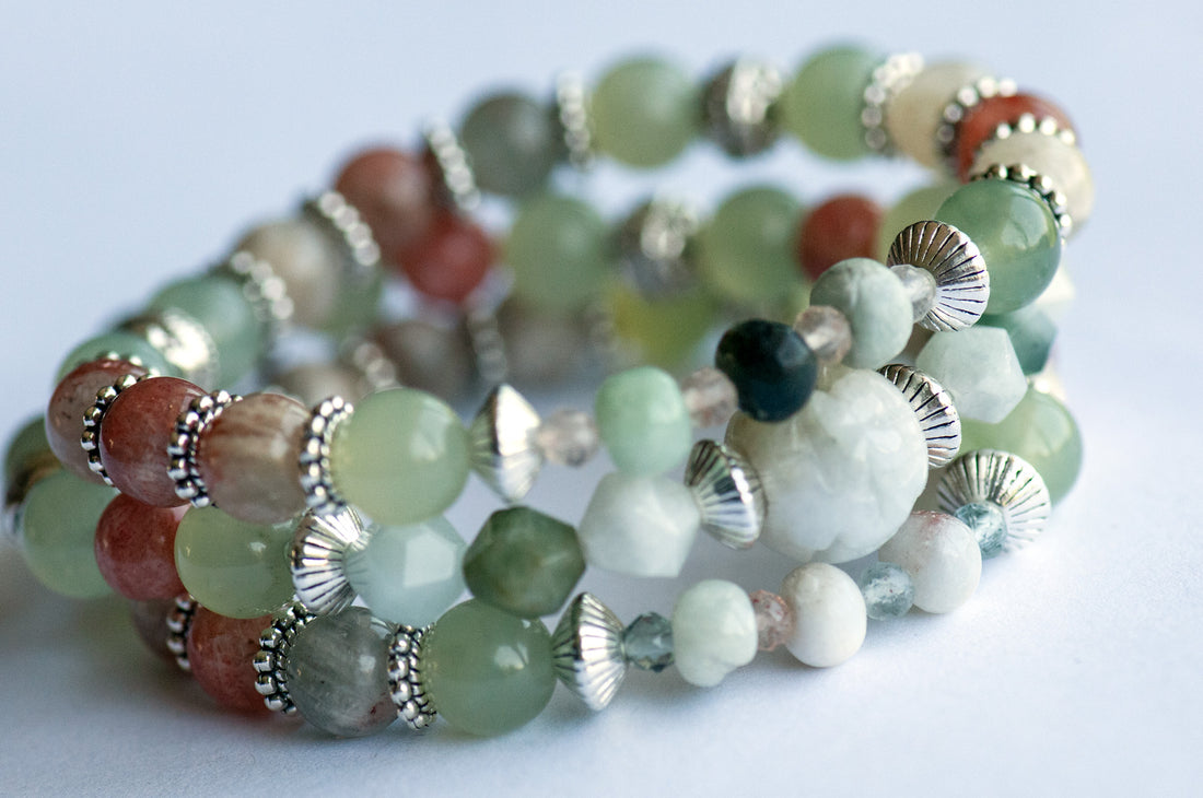 The Fierce Acceptance bracelet set is handmade with Jade, Arusha Sunstone, and Sepentine in calming shades of green and orange.