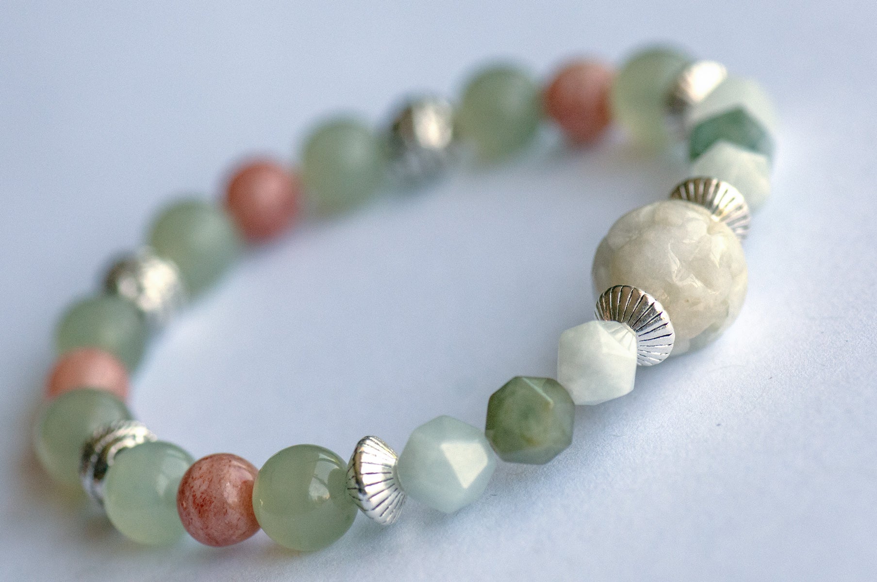 Hand carved Jade focal bead with Burma Jade, New Jade, and Arusha Sunstone