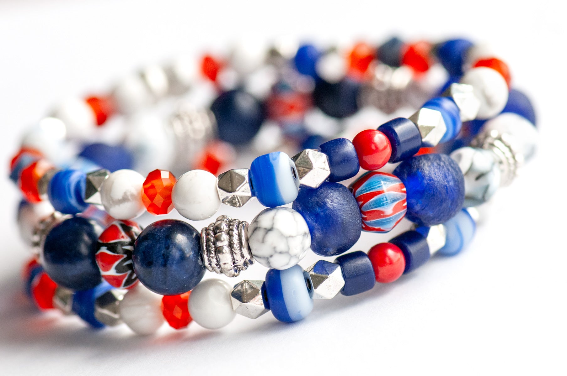 Vibrant Nautical Lynx bracelet set featuring red, white, and blue glass Chevron beads, cobalt blue recycled glass, AA-Grade Sodalite, Howlite rounds, and Tibetan silver spacers