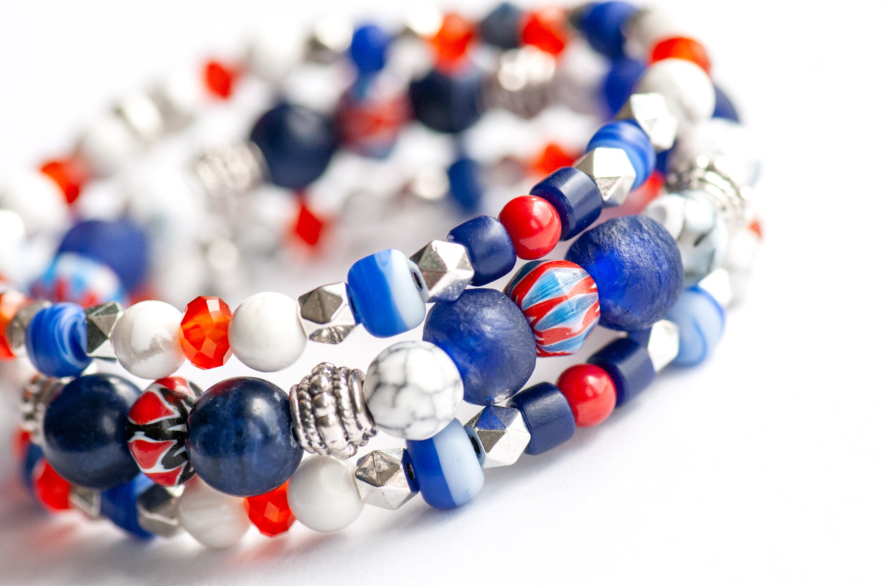 Vibrant Nautical Lynx bracelet set featuring red, white, and blue glass Chevron beads, cobalt blue recycled glass, AA-Grade Sodalite, Howlite rounds, and Tibetan silver spacers