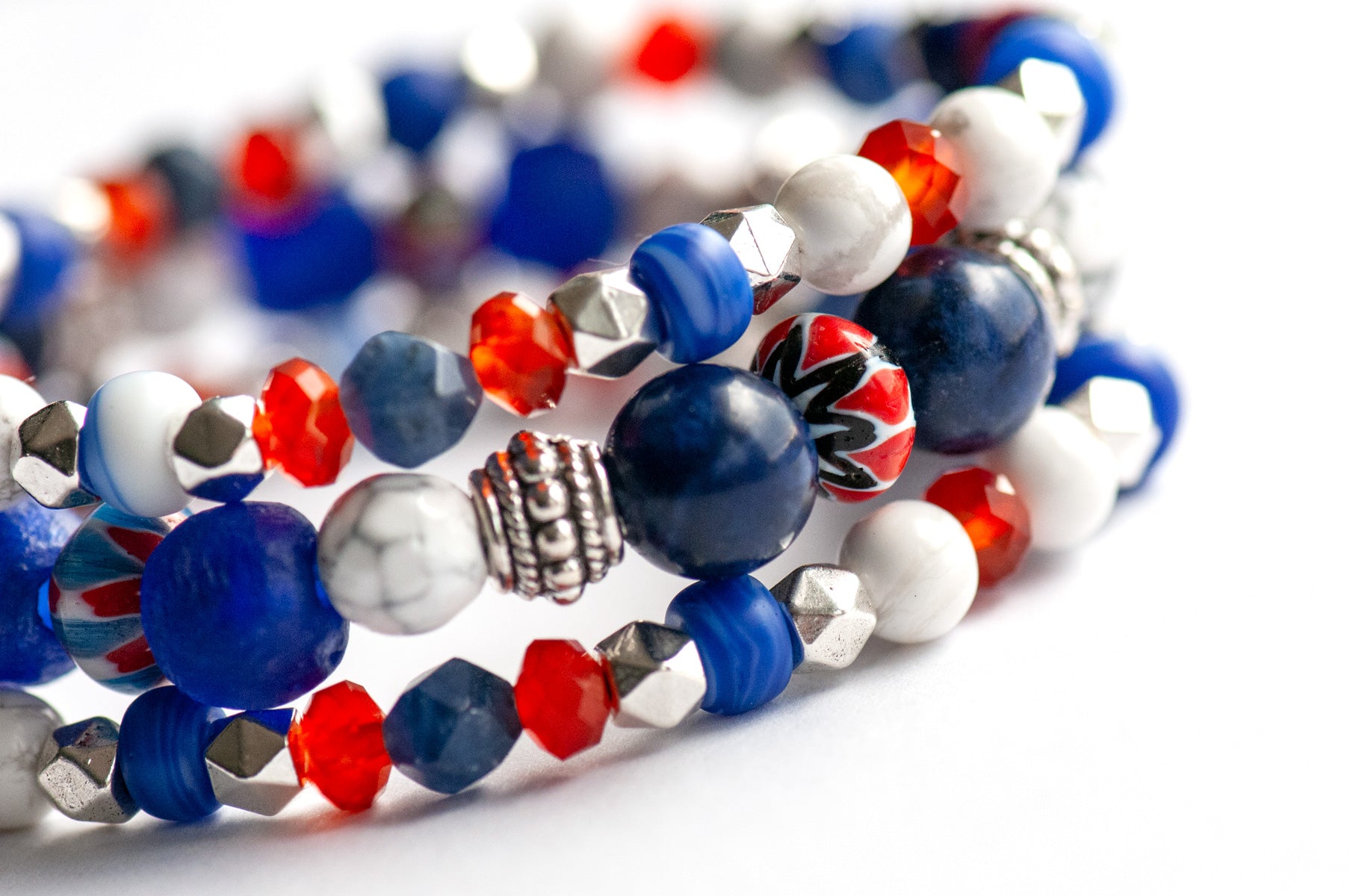 Vibrant Nautical Lynx bracelet set featuring red, white, and blue glass Chevron beads, cobalt blue recycled glass, AA-Grade Sodalite, Howlite rounds, and Tibetan silver spacers