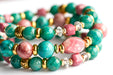 Fierce Compassion bracelet set featuring vibrant pink Thulite, turquoise Crazy Lace Calcite, dark turquoise Russian Amazonite, deep pink Rhodonite, crystal quartz, and gold accents