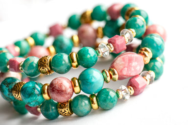 Fierce Compassion bracelet set featuring vibrant pink Thulite, turquoise Crazy Lace Calcite, dark turquoise Russian Amazonite, deep pink Rhodonite, crystal quartz, and gold accents