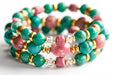 Fierce Compassion bracelet set featuring vibrant pink Thulite, turquoise Crazy Lace Calcite, dark turquoise Russian Amazonite, deep pink Rhodonite, crystal quartz, and gold accents