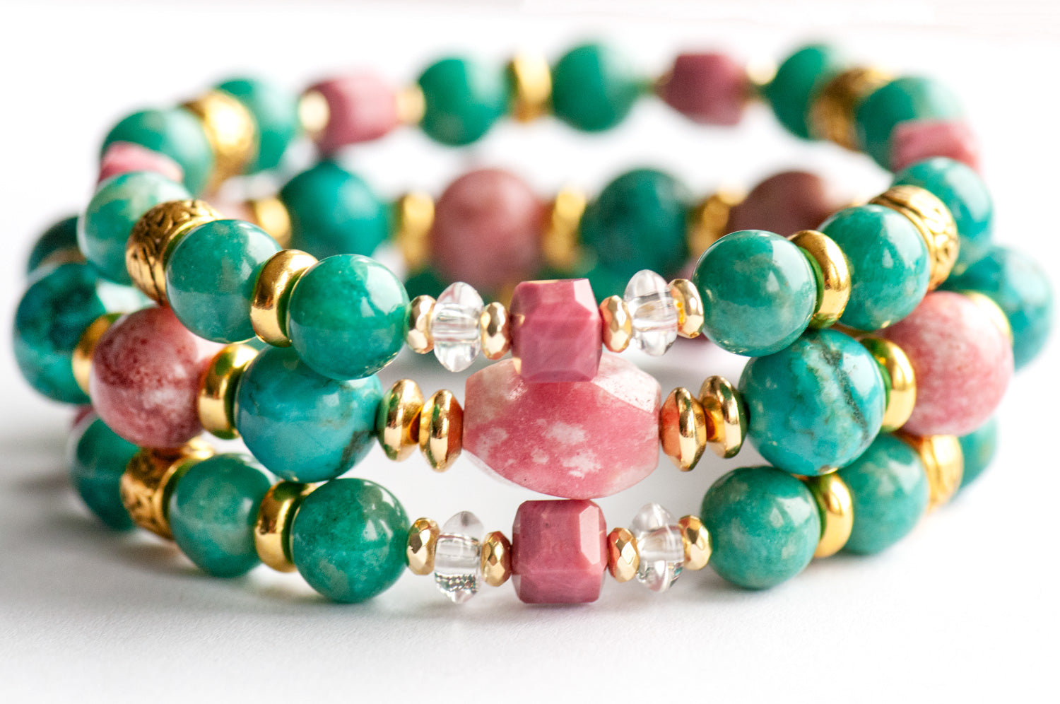 Fierce Compassion bracelet set featuring vibrant pink Thulite, turquoise Crazy Lace Calcite, dark turquoise Russian Amazonite, deep pink Rhodonite, crystal quartz, and gold accents