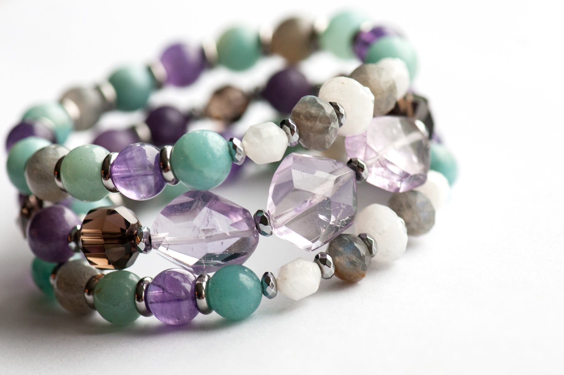 Fierce Healing bracelet set featuring lavender amethyst, smokey quartz, blue amazonite, deep purple amethyst, labradorite, and blue moonstone with hematite and stainless steel accents