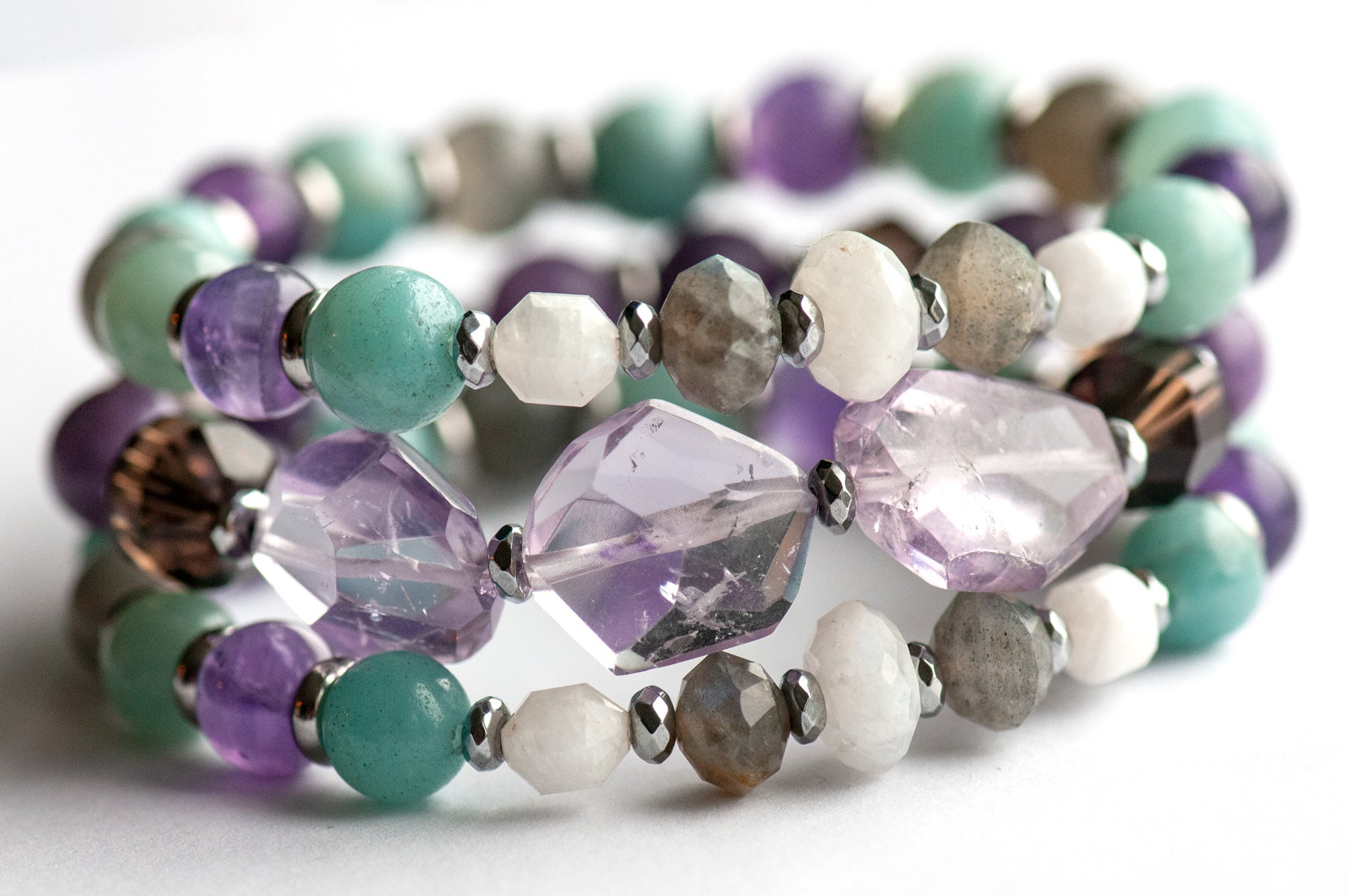 Fierce Healing bracelet set featuring lavender amethyst, smokey quartz, blue amazonite, deep purple amethyst, labradorite, and blue moonstone with hematite and stainless steel accents