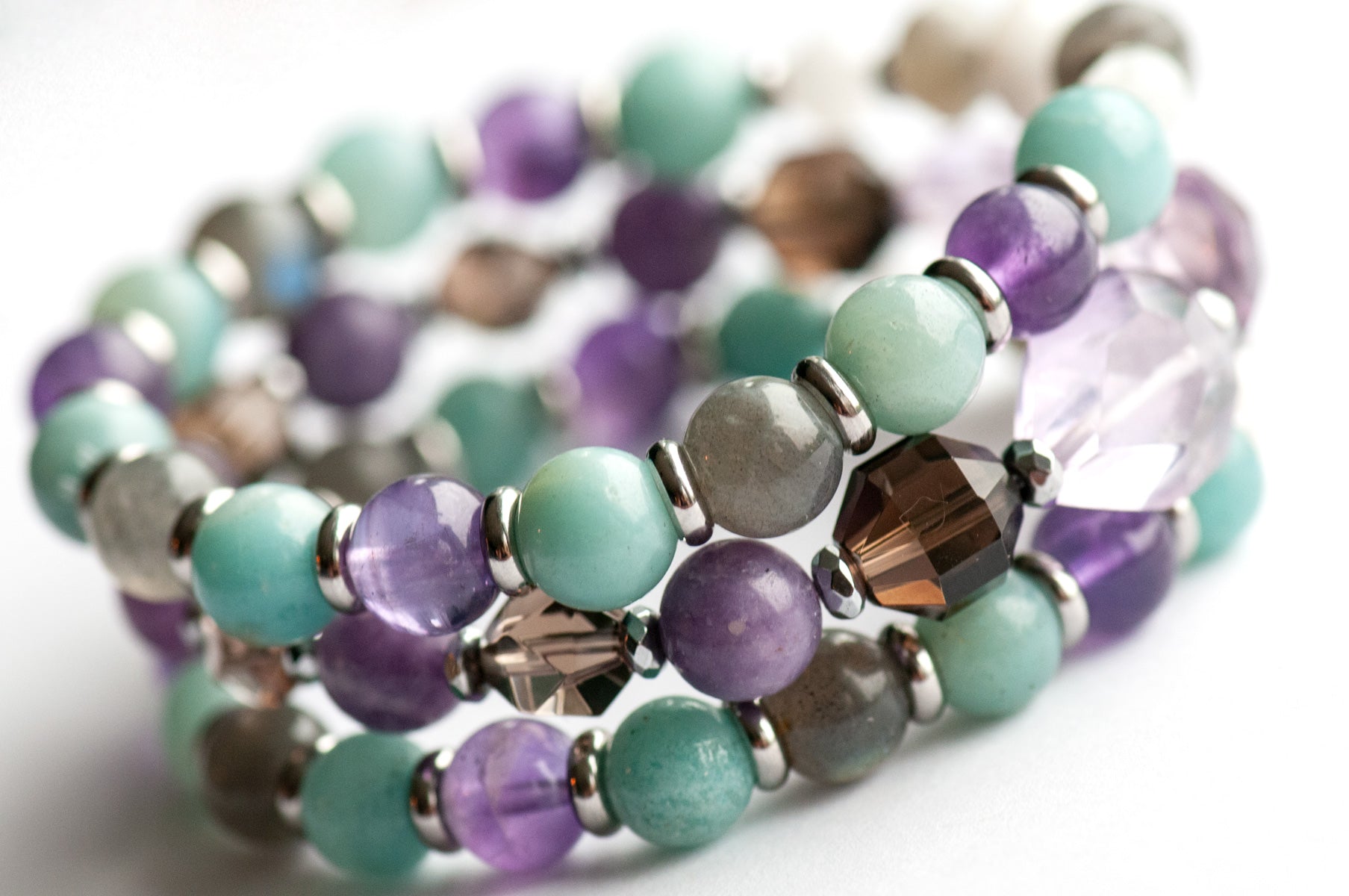 Fierce Healing bracelet set featuring lavender amethyst, smokey quartz, blue amazonite, deep purple amethyst, labradorite, and blue moonstone with hematite and stainless steel accents