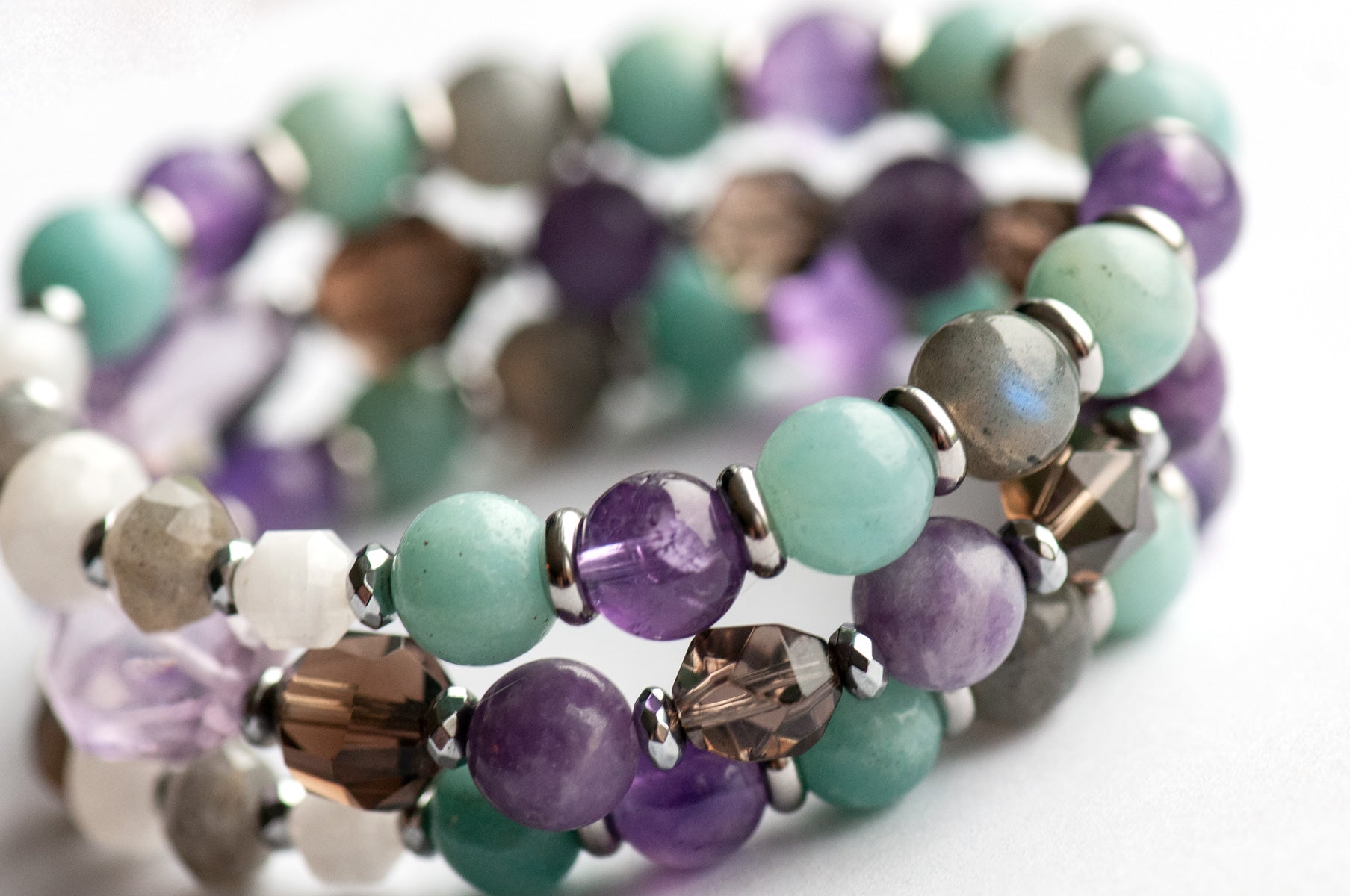 Fierce Healing bracelet set featuring lavender amethyst, smokey quartz, blue amazonite, deep purple amethyst, labradorite, and blue moonstone with hematite and stainless steel accents