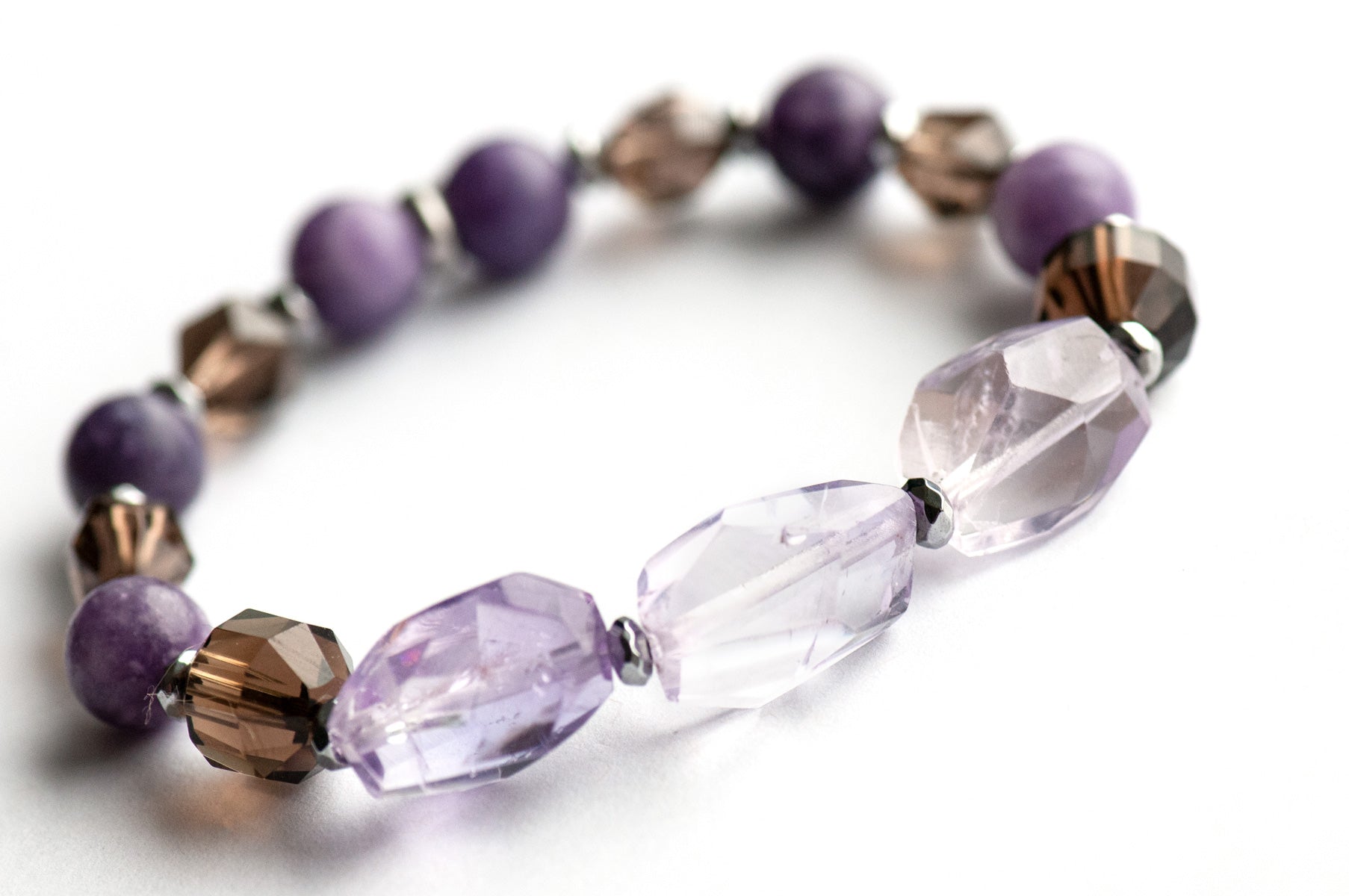 Fierce Healing bracelet set featuring lavender amethyst, smokey quartz, blue amazonite, deep purple amethyst, labradorite, and blue moonstone with hematite and stainless steel accents