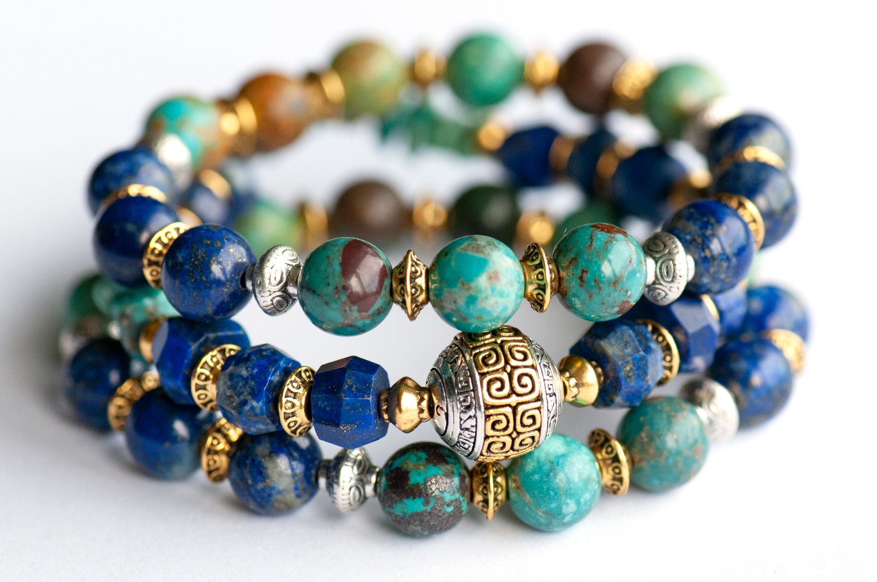 Fierce Harmony bracelet set featuring natural Lapis Lazuli rondelles, Hubei Turquoise chips, and Tibetan metal focal bead in antique silver and gold, with silver and gold spacers