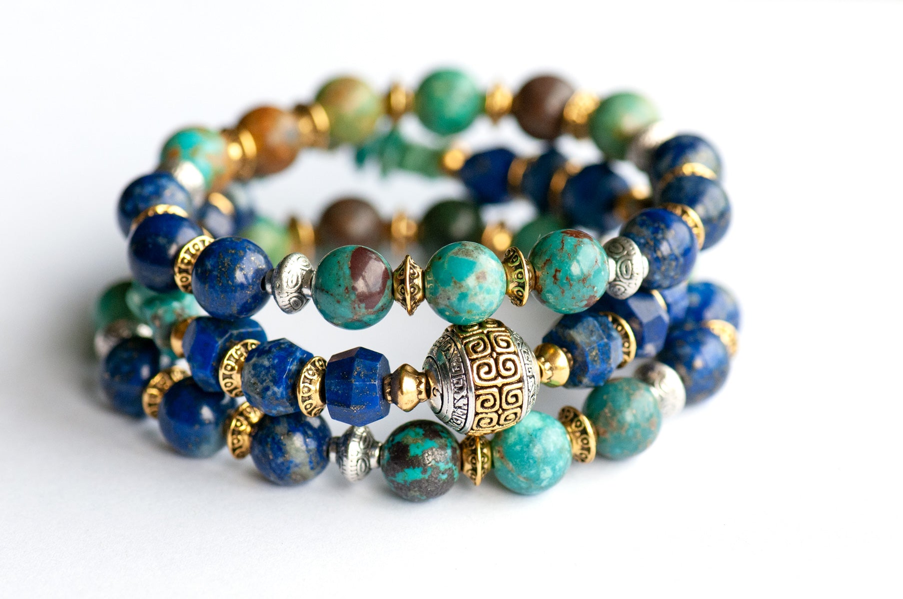 Fierce Harmony bracelet set featuring natural Lapis Lazuli rondelles, Hubei Turquoise chips, and Tibetan metal focal bead in antique silver and gold, with silver and gold spacers