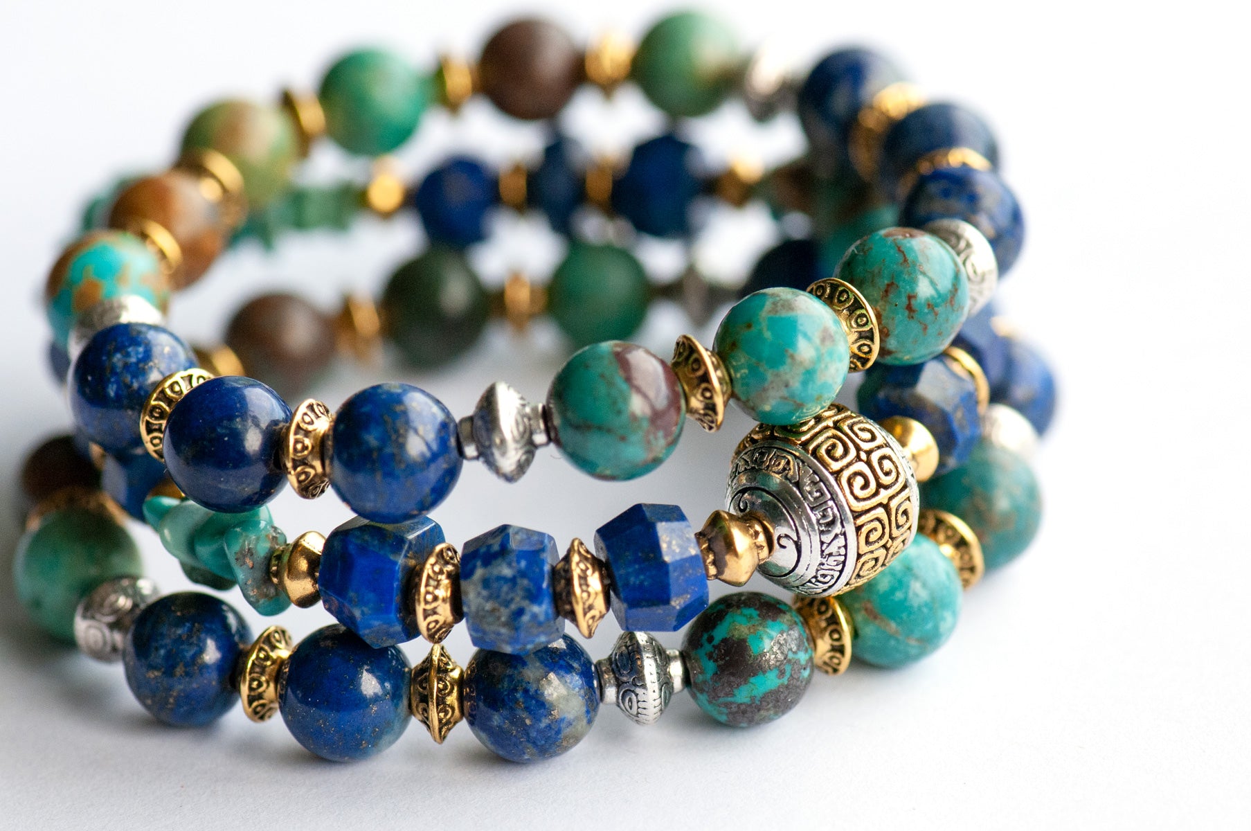 Fierce Harmony bracelet set featuring natural Lapis Lazuli rondelles, Hubei Turquoise chips, and Tibetan metal focal bead in antique silver and gold, with silver and gold spacers