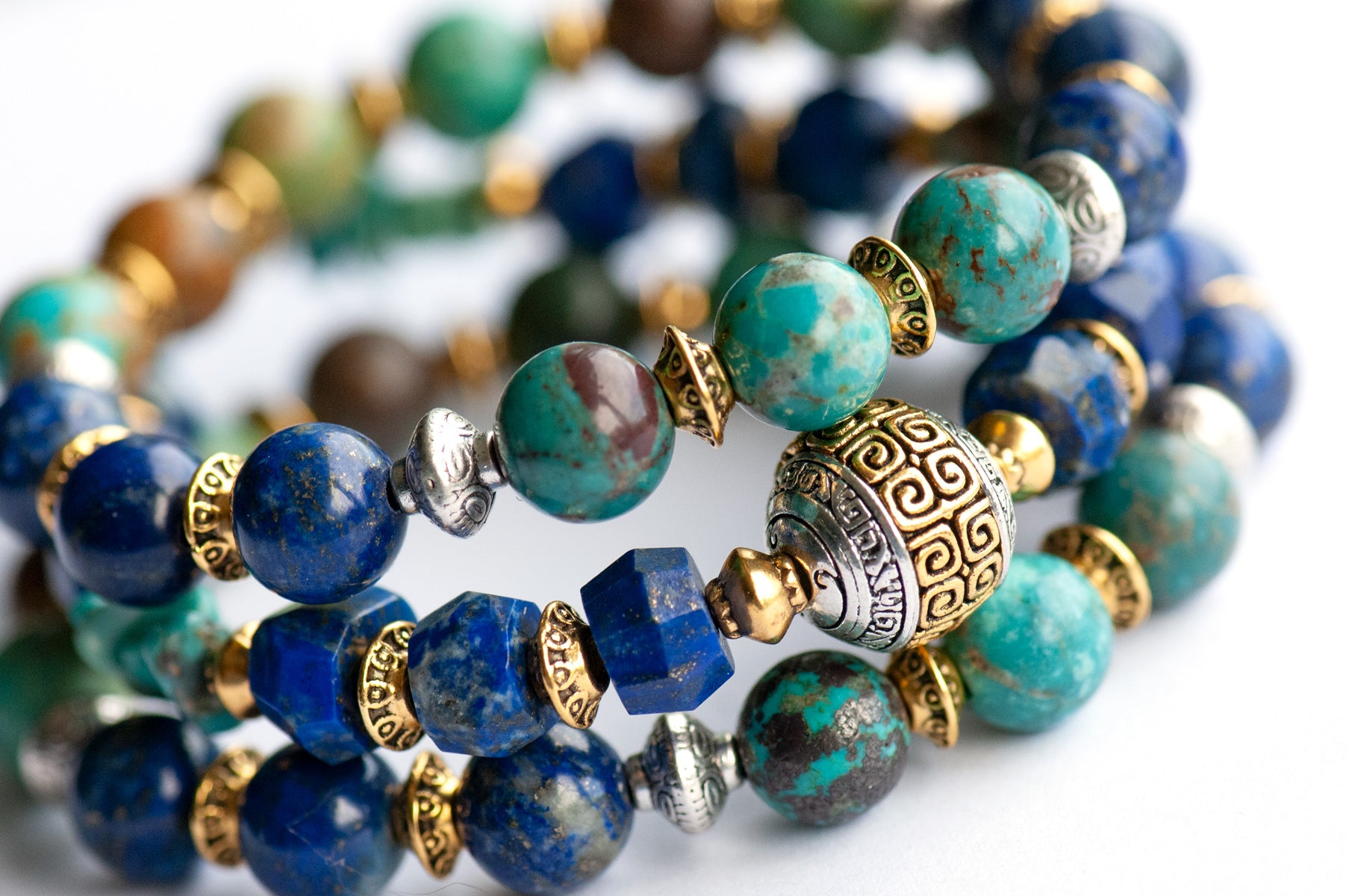 Fierce Harmony bracelet set featuring natural Lapis Lazuli rondelles, Hubei Turquoise chips, and Tibetan metal focal bead in antique silver and gold, with silver and gold spacers