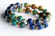 Fierce Harmony bracelet set featuring natural Lapis Lazuli rondelles, Hubei Turquoise chips, and Tibetan metal focal bead in antique silver and gold, with silver and gold spacers